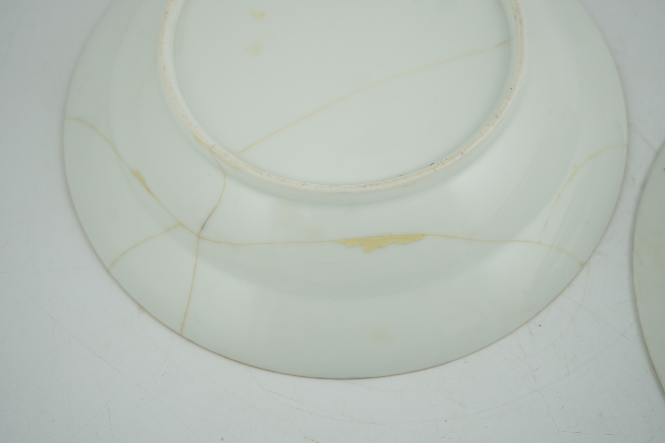 A pair of Nicholas II Imperial porcelain factory plates, from the Gothic service, green printed marks, 23.5cm diameter. Condition - poor to fair repairs